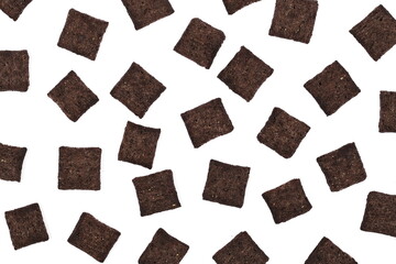 Cereal flakes in form of pillows, with vanilla flavor, pile isolated on white