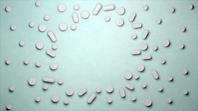Stop motion animation white pills on a blue background, top view. Medical drugs empty space in the centre. Tablet 4k stock videos and footage