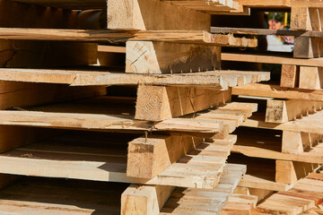 Stack of wooden pallets outdoors. 