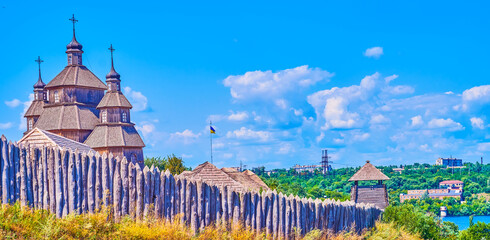 Church of the Intercession behind stockade of .Zaporizhian Sich Fort scansen in Zaporizhzhia,...