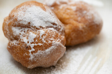 Two cream carnival pancakes or carnival fritters, italian traditional sweet