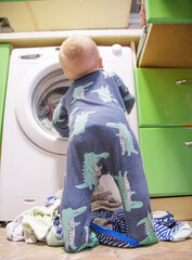 Child near the washing machine