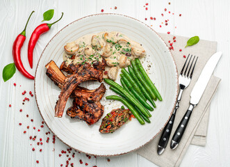 lamb rack barbecue served with side dishes