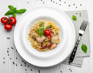 Italian pasta with salmon, cheese and tomatoes