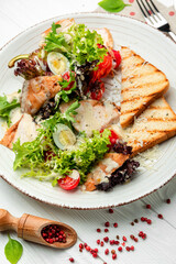 Healthy Grilled Chicken Caesar Salad with Cheese and Croutons