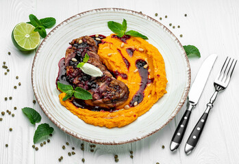 Duck fillet in cherry sauce with pumpkin puree