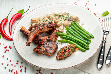 lamb rack barbecue served with side dishes