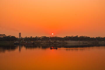Fototapeta premium Sunset photography on the river in winter 2022. This image was taken by me on January 17, 2022, from the Doleswori river, Bangladesh, South Asia.