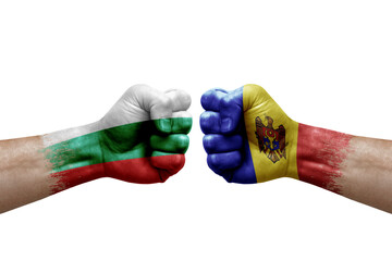 Two hands punch to each others on white background. Country flags painted fists, conflict crisis concept between bulgaria and moldova
