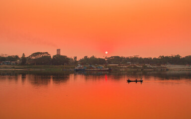 Fototapeta premium Sunset photography on the river in winter 2022. This image was taken by me on January 17, 2022, from the Doleswori river, Bangladesh, South Asia.