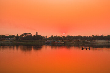 Fototapeta premium Sunset photography on the river in winter 2022. This image was taken by me on January 17, 2022, from the Doleswori river, Bangladesh, South Asia.