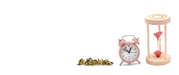 a table clock and an hourglass with Vintage cogs gears wheels on a white background