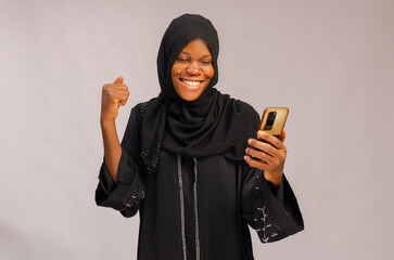 excited muslim lady isolated over white background