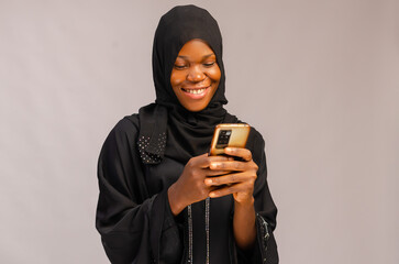 lady isolated of white background excited about what she saw on her phone