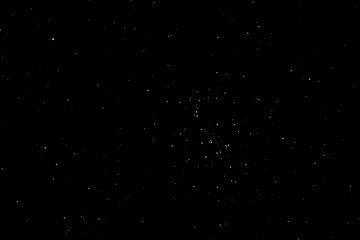 Naklejka na ściany i meble Praesepe star cluster or beehive star cluster on a dark winter night in Ohio. Also known as Messier 44 or M44 in the breast of the Cancer Constellation.