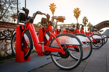 Obraz na płótnie Canvas Bike rental station. The row of bicycles is ready for sharing
