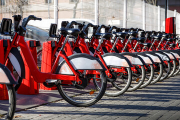 Bike rental station. The row of bicycles is ready for sharing