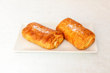 The Neapolitan is a famous pastry product and a type of bun, quite commercialized today. It is a cream filling wrapped in a puff pastry