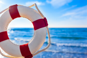 Summer Beach Travel Vision / View through and beside nostalgic life buoy decoration to sea horizon (copy space) - 487890116