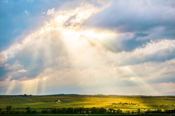 Rays of Sun Falling on Green Farmland in Colorado