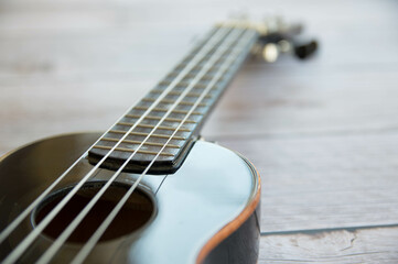 Obraz premium Ukulele black musical instrument close up