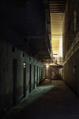 Fototapeta na wymiar Dark and Haunted Abandoned Prison Cell Block