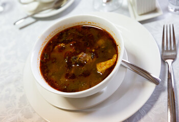 Traditional soup of Georgian cuisine Kharcho from beef meat in a plate