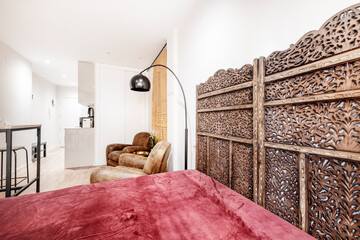 Study with arabic type furniture with red velvet blanket and old brown leather sofas