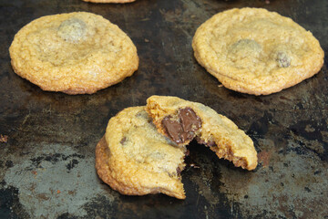 Fresh Chocolate Chip Cookie Close Up on a Vintage Baking Sheet with Melting Chocolate, Real Kitchens