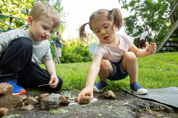 Kids Engaging in Creative Free Play Outdoors in Backyard