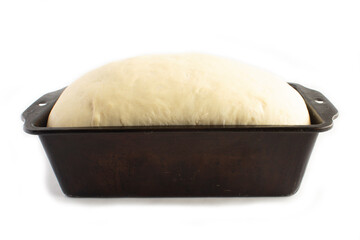 Rising Bread Dough in Black Vintage Pan Homemade and on the Second Rise Isolated on White