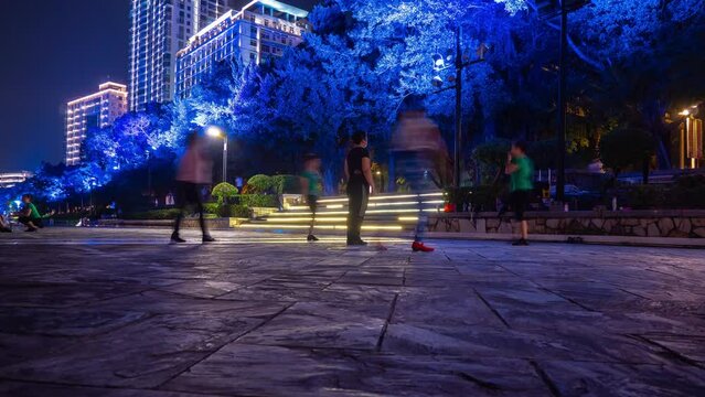 night time illuminated sanya city river bay dancing class panorama 4k hainan island china