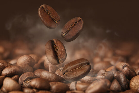 Aromatic roasted coffee beans and steam, closeup © New Africa