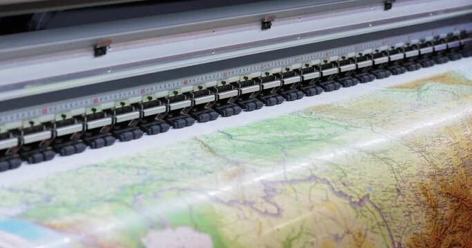 Modern Digital Large format UV printer. Printing production technologies. UV pinning is the process of applying a dose of low intensity ultraviolet light to a UV curable ink