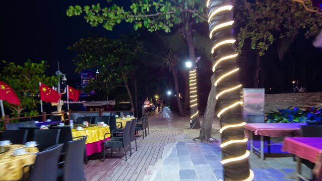 night illuminated sanya city dadonghai beach restaurant street walking panorama timelapse 4k hainan island china