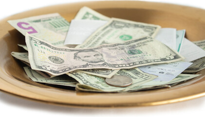 Offering Plate with Cash and Checks and Money with Shallow Depth of Field, Collection Tray, Tithes and Offerings, Church Money Concept
