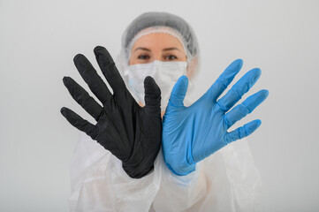 Doctors hands in blue rubber gloves in hospital