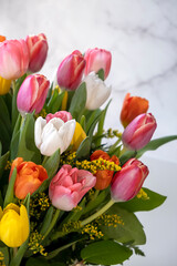 Fresh, lush bouquet of colorful tulip flowers on white background. Happy birthday, valentines day or womens day of 8 march concept