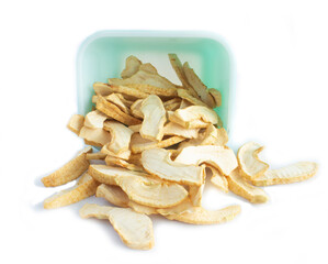 Dehydrated Apple Slices Spilling out of Rectangular Dish Isolated on White