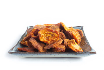 Unsulphured Dried Apricots, Organically Grown, on Square Blue Plate Isolated on White