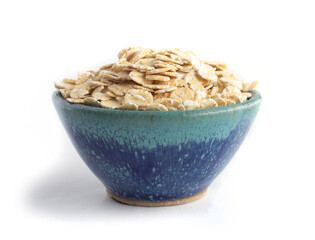 Barley Flakes in Blue Pottery Bowl Isolated on White
