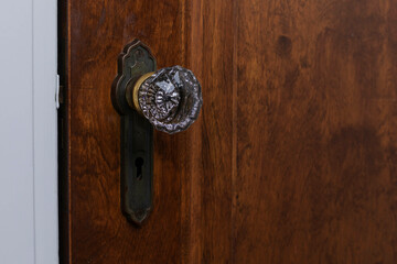 Old Antique crystal doorknob on wooden door