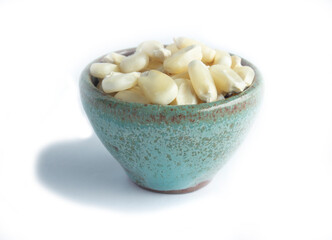 Whole Kernel Corn that's Organically Grown Heaped in Green Pottery Bowl