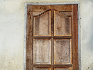 Antique wooden brown window in vintage style.  Concept of house interior, exterior design, retro, countryside style.
