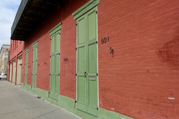 Red brick building with green doors