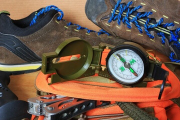 Compass and old hiking shoes