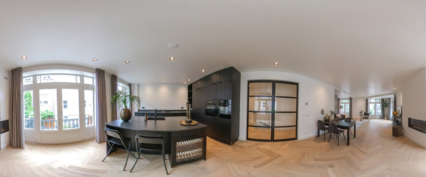 Modern kitchen with black furniture and wooden floor
