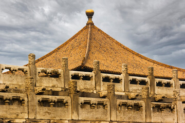 Fototapeta na wymiar Building tile roof against a stormy sky, Forbidden City, Beijing, China