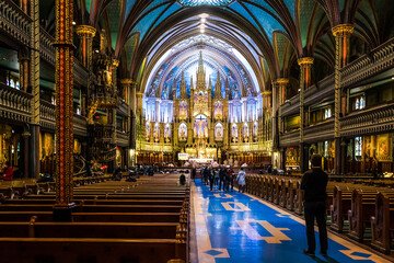 Architectural detail of Notre-Dame Basilica, a basilica in the historic district of Old Montreal. Its dramatic interior is considered a masterpiece of Gothic Revival architecture - obrazy, fototapety, plakaty
