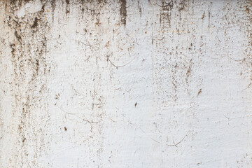 Old, rusty, painted in white, metallic background with scratches and cracks.